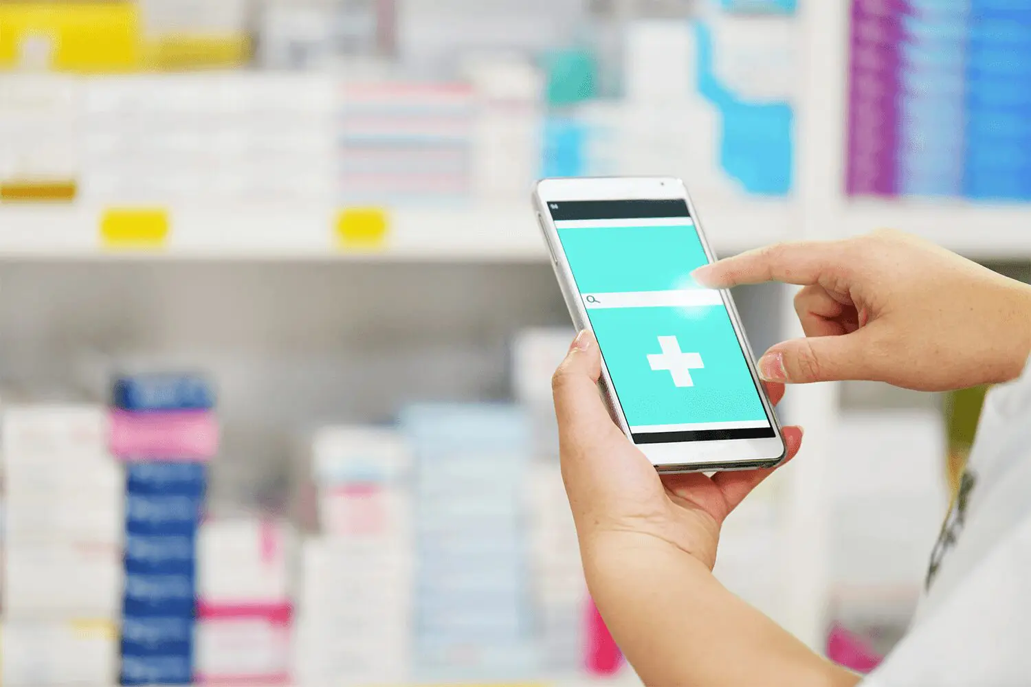 person holding a cellphone inside of pharmacy