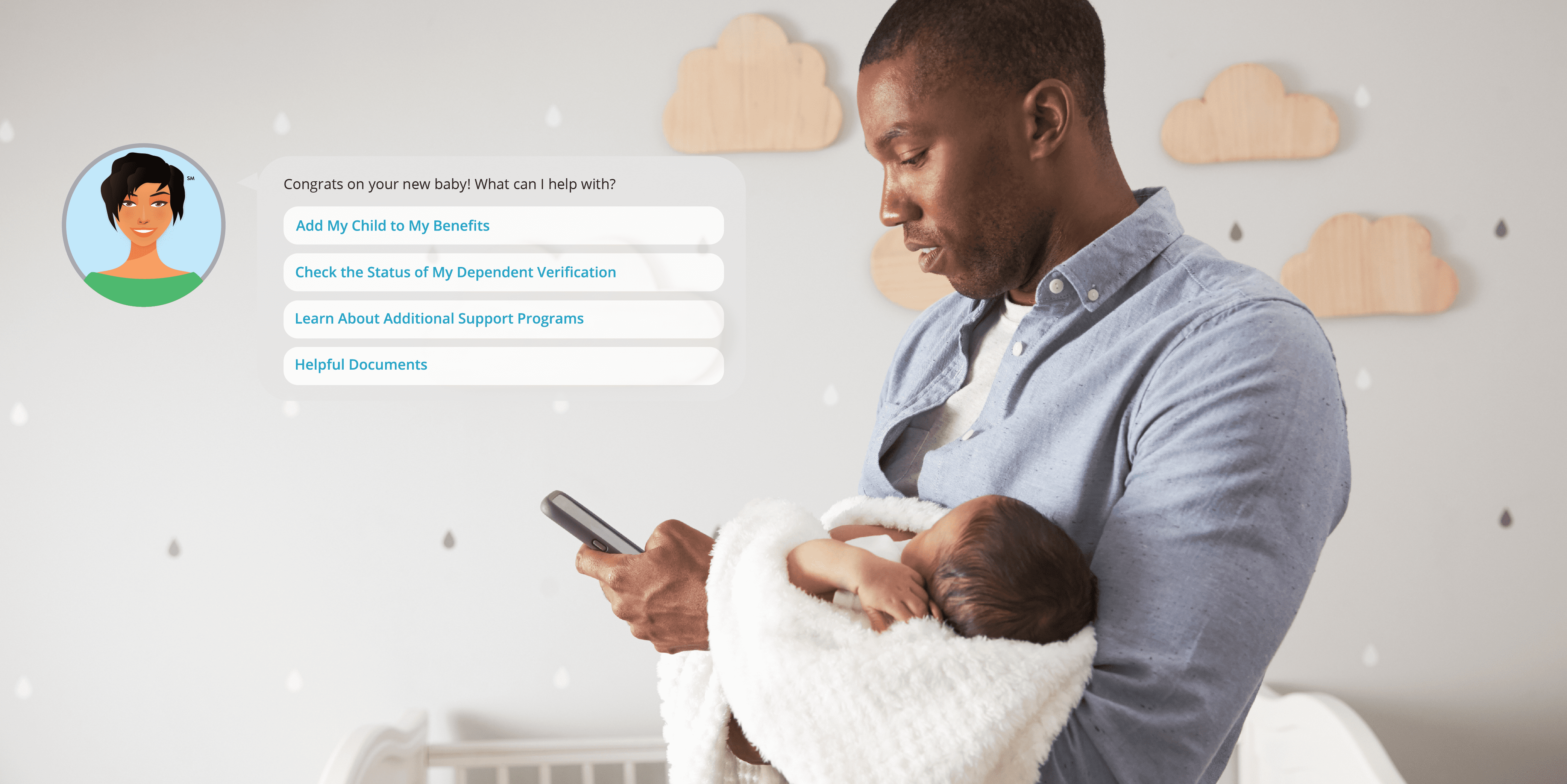 man looking at his phone while holding a baby